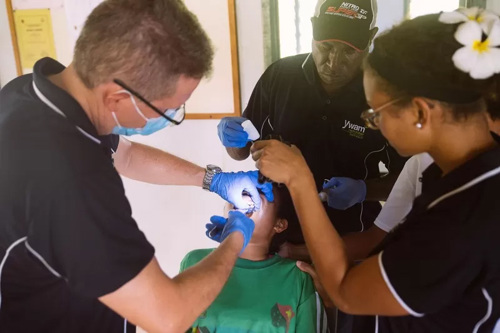 Dental team working on patient